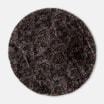Okrągły dywan w stylu animal print prezentowany w całości.