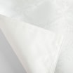 Zbliżenie na róg podkładki natalia z widoczną strukturą materiału i wzorem.