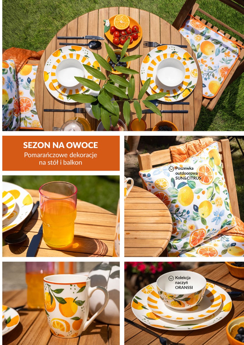 Letnia aranżacja stołu z kolekcją porcelany ORANSSI z motywem pomarańczy. Na stole znajdują się talerze, kubki, szklanki z lemoniadą, owoce cytrusowe, zielone wazony oraz poduszka outdoorowa Sun&Citrus. 