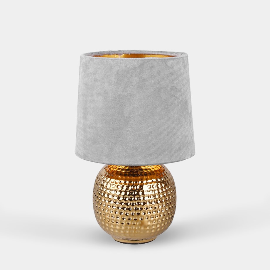 Lampa stołowa z abażurem popielato-złota widoczna od przodu.
