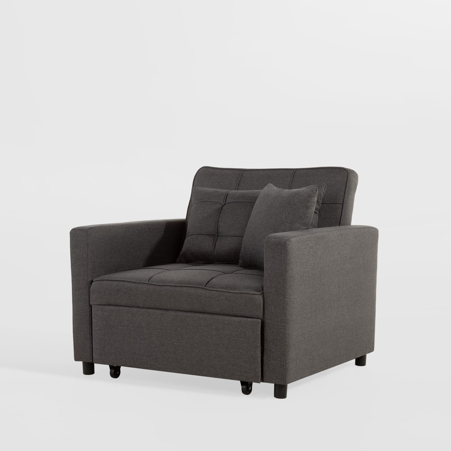 Szara sofa sapuri widziana pod lekkim kątem na jasnym tle.