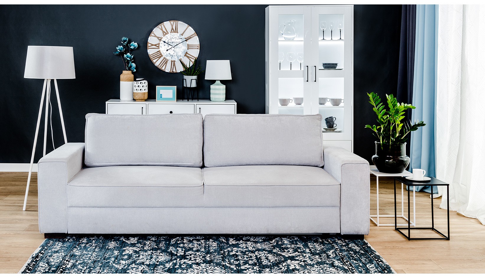 sofa rozkładana w kolorze szarym