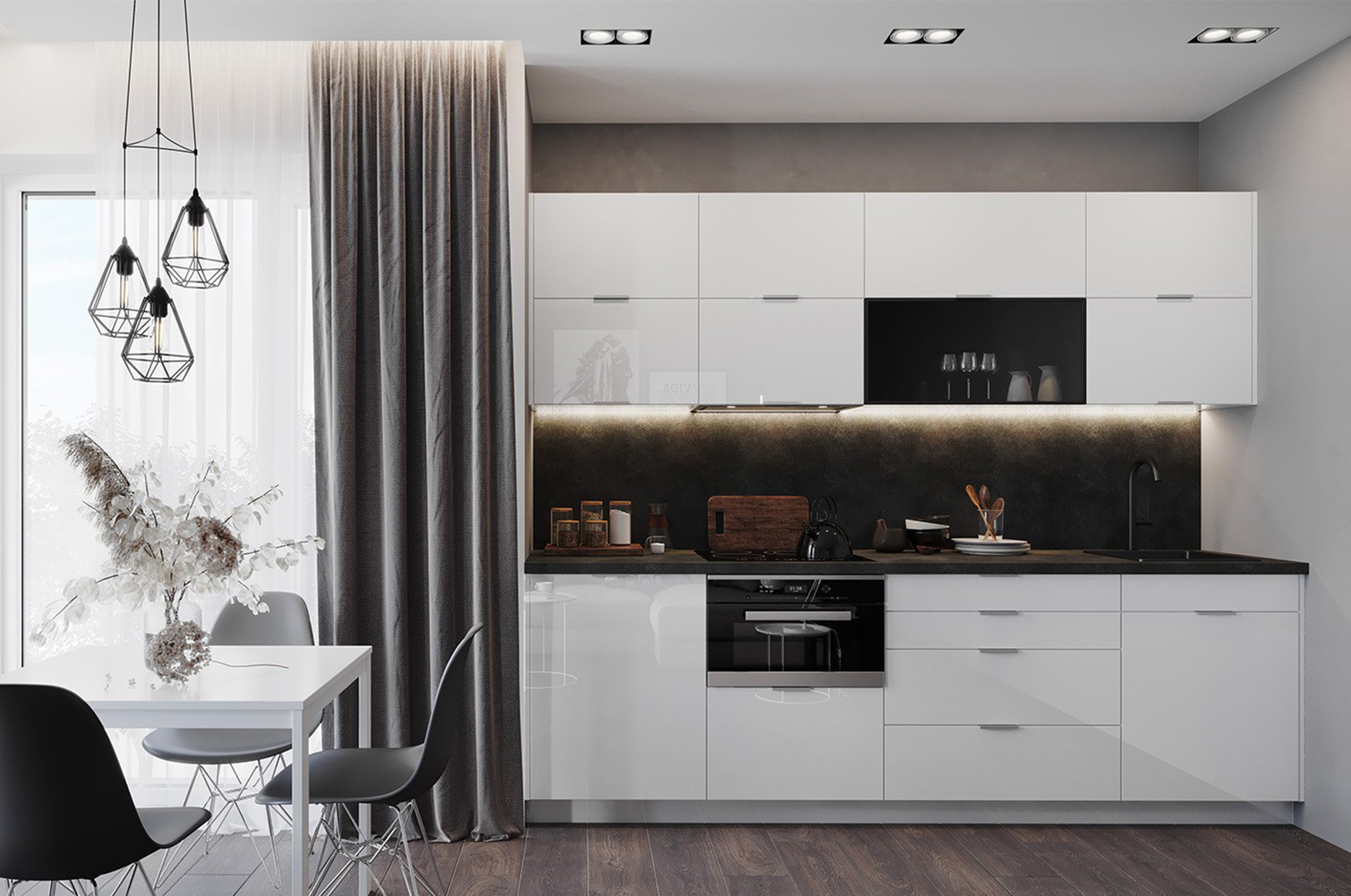 Nowoczesna kuchnia z białą zabudową na wysoki połysk, czarnym blatem oraz strefą jadalnianą z designerskim oświetleniem w minimalistycznej aranżacji wnętrza.